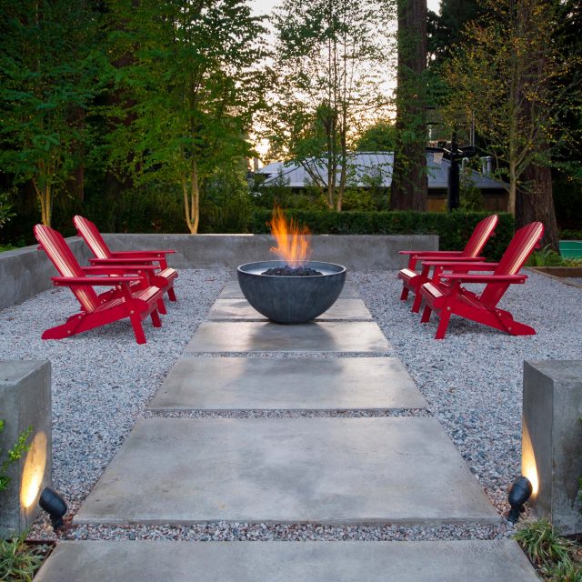 Outdoor living space with fire bowl by Rockridge Developments