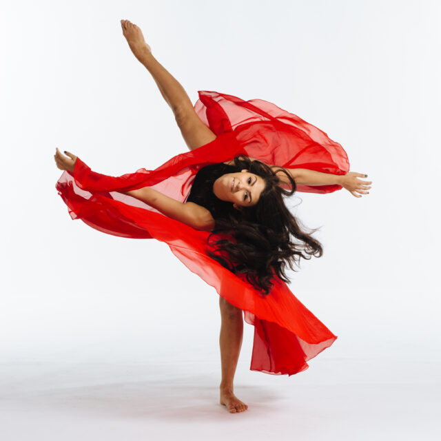 Lyrical Dancer Posing in a Red Skirt